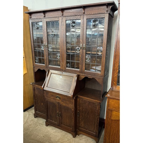 121 - An Arts & Crafts oak bureau bookcase, manner of Liberty & Co.