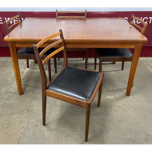 61 - A Danish teak rectangular extending dining table and a set of four G-Plan Fresco teak dining chairs