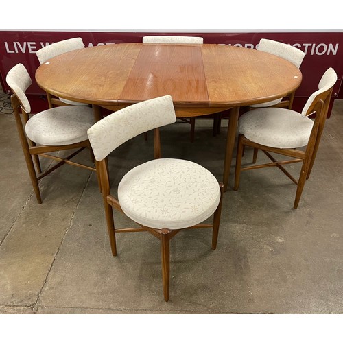 62 - A G-Plan Fresco teak circular extending dining table and six chairs