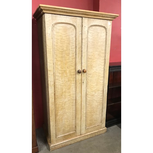 102 - A Victorian scumbled pine fitted press cupboard