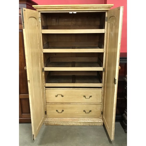 102 - A Victorian scumbled pine fitted press cupboard