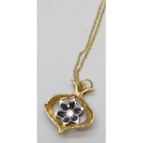 7003 - A 9ct gold, sapphire and diamond pendant on a 9ct gold chain, 2.6g total, 2cm pendant