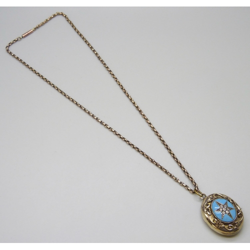 7015 - A Victorian gilt paste set locket on a belcher chain,  4.3cm including bale