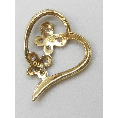 7026 - A 9ct gold heart shaped diamond set pendant, 1g, 1.7cm