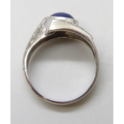 7034 - A 9ct white gold, star sapphire and diamond ring, 4.7g, N