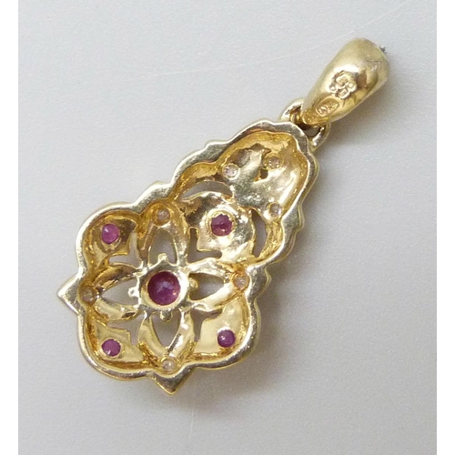 7035 - A 9ct gold, diamond and ruby pendant, 2.3g, 2.5cm