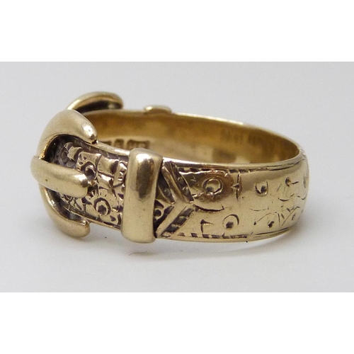 7038 - A 9ct gold double buckle ring, 4.5g, N