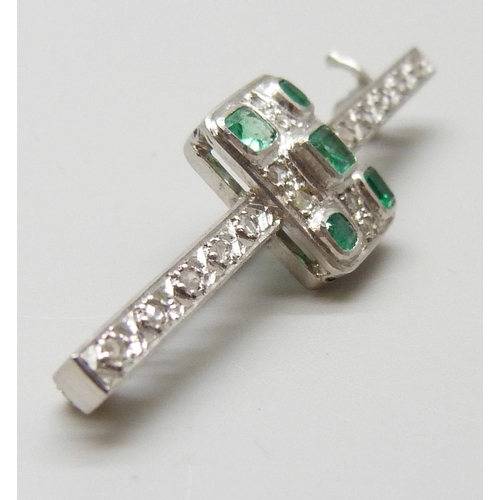 7039 - An Art Deco platinum set emerald and diamond bar brooch, 6.2g, 4.9cm, with box