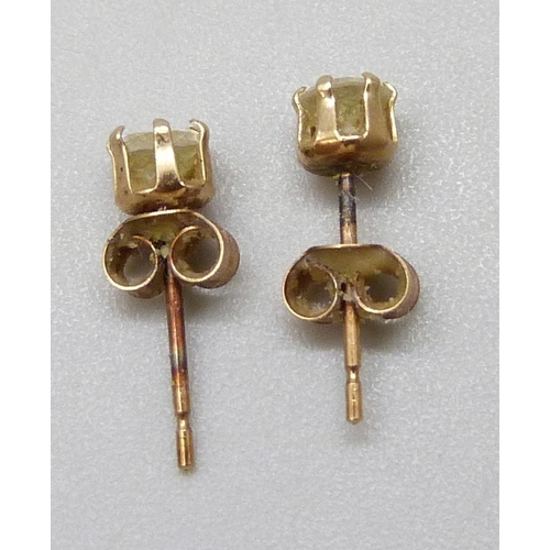 7054 - A pair of yellow metal diamond set stud earrings, 0.2g