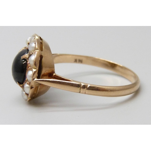 7058 - A 14k gold, cabochon stone and seed pearl ring, lacking one pearl, 2.8g, R