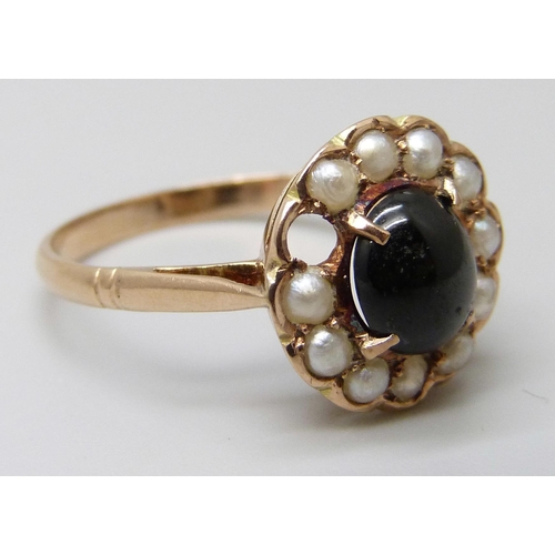 7058 - A 14k gold, cabochon stone and seed pearl ring, lacking one pearl, 2.8g, R