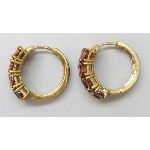 7060 - A pair of silver gilt garnet set cuff earrings, 1cm wide