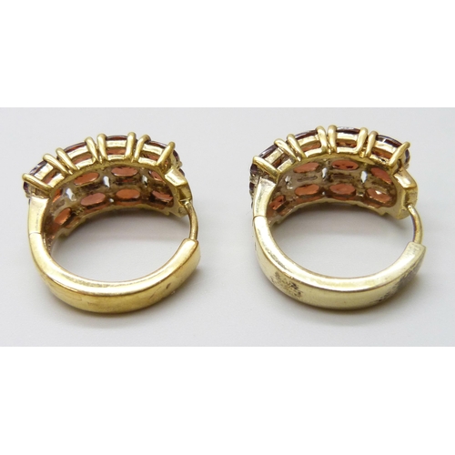 7060 - A pair of silver gilt garnet set cuff earrings, 1cm wide