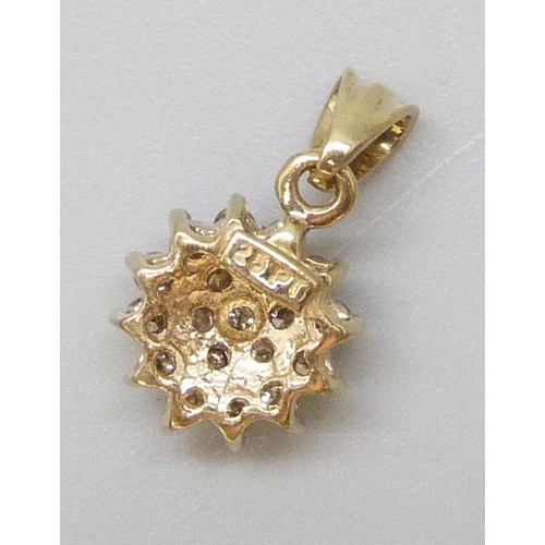 7061 - A yellow metal diamond set cluster pendant, 0.8g, 0.25ct marked verso, 1.4cm