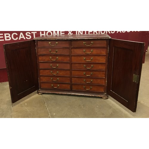 103 - A Victorian mahogany and stained pine fitted two door collectors cabinet