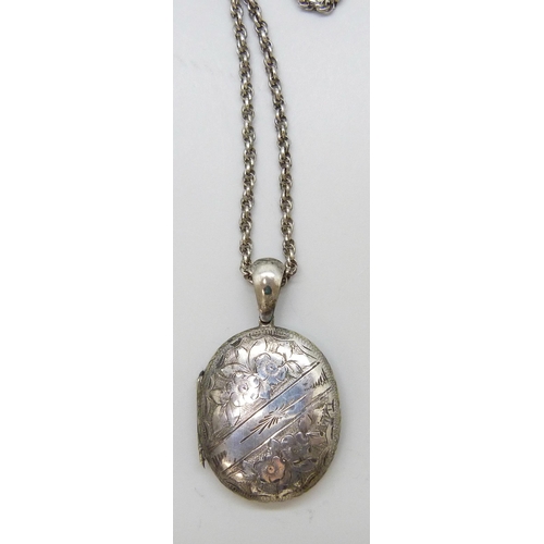 7084 - A Victorian white metal locket, 14g, 5cm, on a long chain