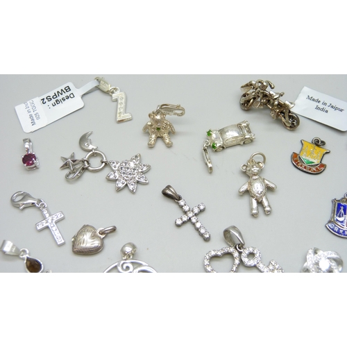 7086 - A collection of silver charms and pendants including TGGC, 43g, a white metal teddy bear charm and t... 