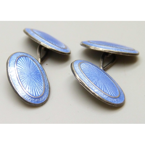 7092 - A pair of early 20th Century silver and blue guilloche enamel cufflinks, in a box