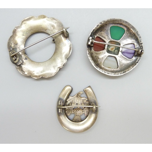 7099 - Two Victorian Scottish white metal stone set brooches and a later example, largest 4.2cm, 24g total