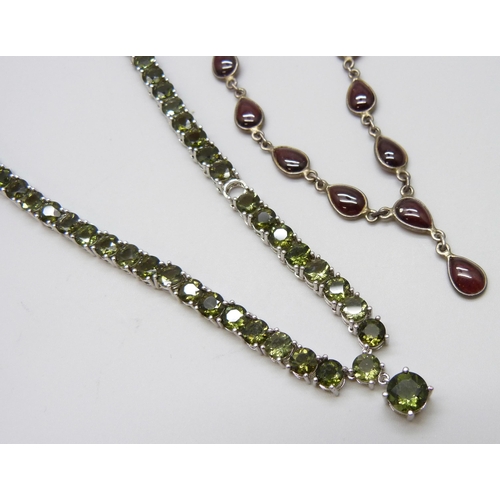 7112 - A silver and garnet set necklace and a silver TGGC tennis necklace, 23g total