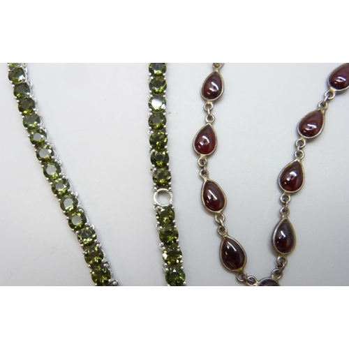 7112 - A silver and garnet set necklace and a silver TGGC tennis necklace, 23g total