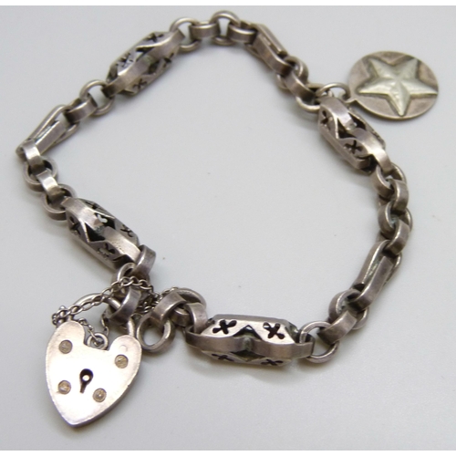 7117 - A Victorian white metal bracelet with a silver padlock clasp, a silver and mother of pearl bracelet ... 