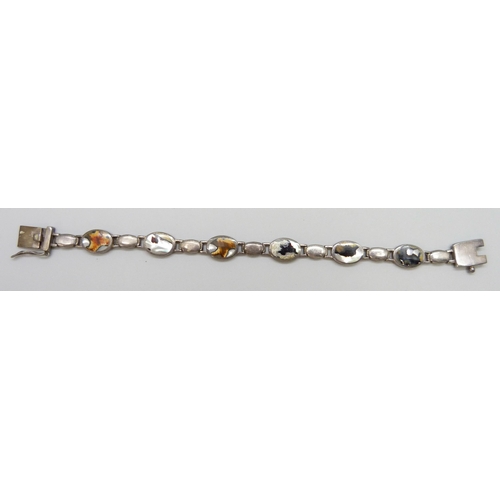 7117 - A Victorian white metal bracelet with a silver padlock clasp, a silver and mother of pearl bracelet ... 