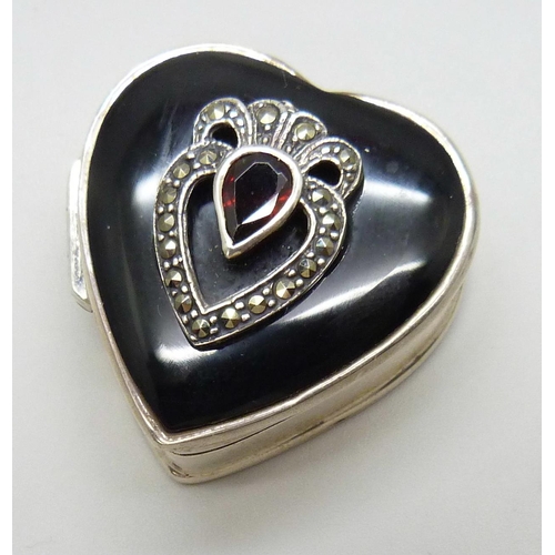 7124 - A silver, onyx, garnet and marcasite pill box, 3cm, 17.8g, together with an enamelled patch box, mar... 