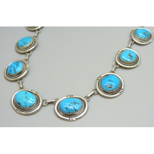 7126 - A Navajo sterling silver panel necklace set with turquoise, possibly Gilbert Damon, 48g, 41cm