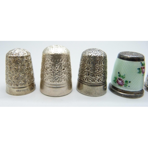 7127 - Four silver thimbles including a guilloche enamel example and Charles Horner, together with three ot... 