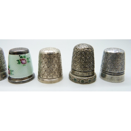 7127 - Four silver thimbles including a guilloche enamel example and Charles Horner, together with three ot... 