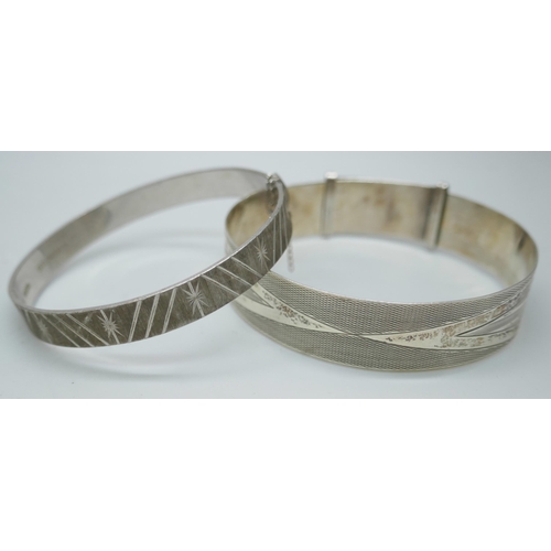 7147 - Two silver bangles, an Eastern metal torque bangle and a Danish white metal bangle