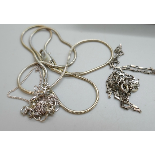 7150 - A collection of silver chains, 39g, together with 8 plated chains