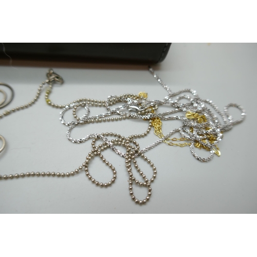 7150 - A collection of silver chains, 39g, together with 8 plated chains