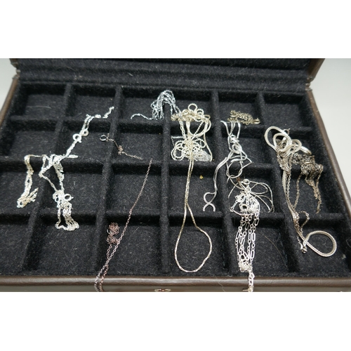 7150 - A collection of silver chains, 39g, together with 8 plated chains