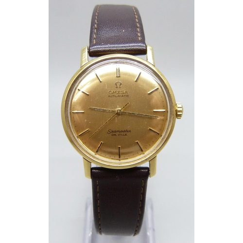 7158 - An 18ct gold Omega Seamaster wristwatch with automatic movement, the gold dial with gold and black b...