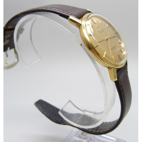 7158 - An 18ct gold Omega Seamaster wristwatch with automatic movement, the gold dial with gold and black b... 