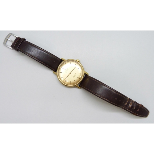 7158 - An 18ct gold Omega Seamaster wristwatch with automatic movement, the gold dial with gold and black b... 