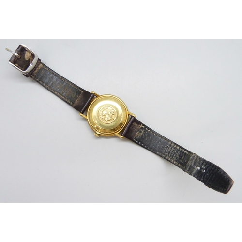 7158 - An 18ct gold Omega Seamaster wristwatch with automatic movement, the gold dial with gold and black b... 