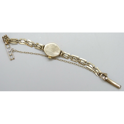 7159 - A lady's 9ct gold cased wristwatch on a 9ct gold strap, 6.1g without movement