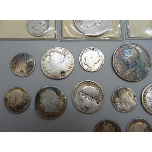 7197 - A collection of silver coins, most coins drilled, a 1917 half crown, an 1825 half crown, an 1837 six... 