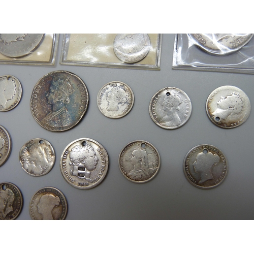 7197 - A collection of silver coins, most coins drilled, a 1917 half crown, an 1825 half crown, an 1837 six... 