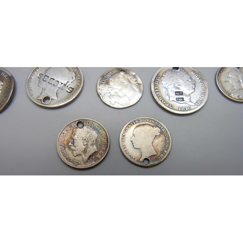 7197 - A collection of silver coins, most coins drilled, a 1917 half crown, an 1825 half crown, an 1837 six... 