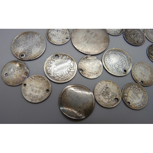 7197 - A collection of silver coins, most coins drilled, a 1917 half crown, an 1825 half crown, an 1837 six... 