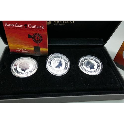 7220 - The Perth Mint, Australian Outback coloured silver coin collection ½oz silver three coin set, with c... 