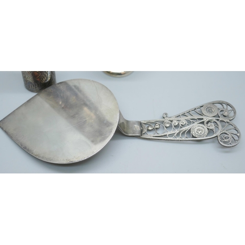 7230 - A .830 silver server, a silver case and a miniature silver two handled bowl, 2cm tall, 49g total