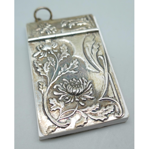 7232 - A silver Art Nouveau style note pad, 5.5cm, together with a silver propelling pencil, lacking mechan... 