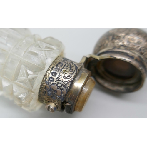 7233 - A Victorian silver mounted cut glass double ended scent bottle with monogram, Brockwell & Co, London... 