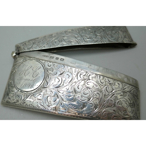 7242 - A silver Victorian engraved card case with inscription dated 1898, 36g