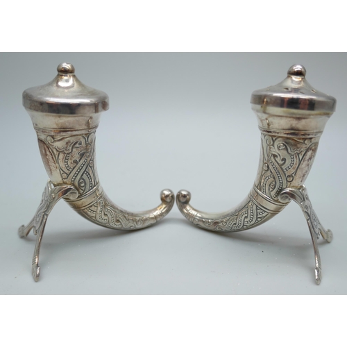 7243 - A pair of Theodor Olsen Norwegian silver salt and pepper pots in the form of Viking drinking horns, ... 